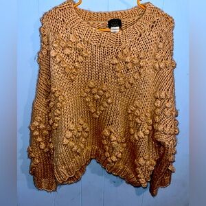 A sweater in the color brown brand M|2